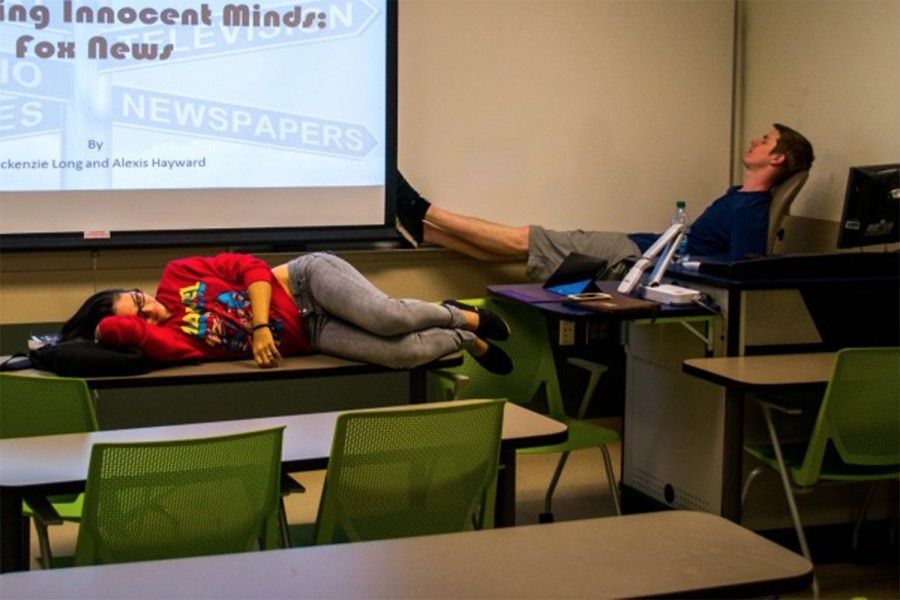 After finishing their final English project, two students sleep in a Culture and Society classroom. Alexis Hayward | Web Assistant 

