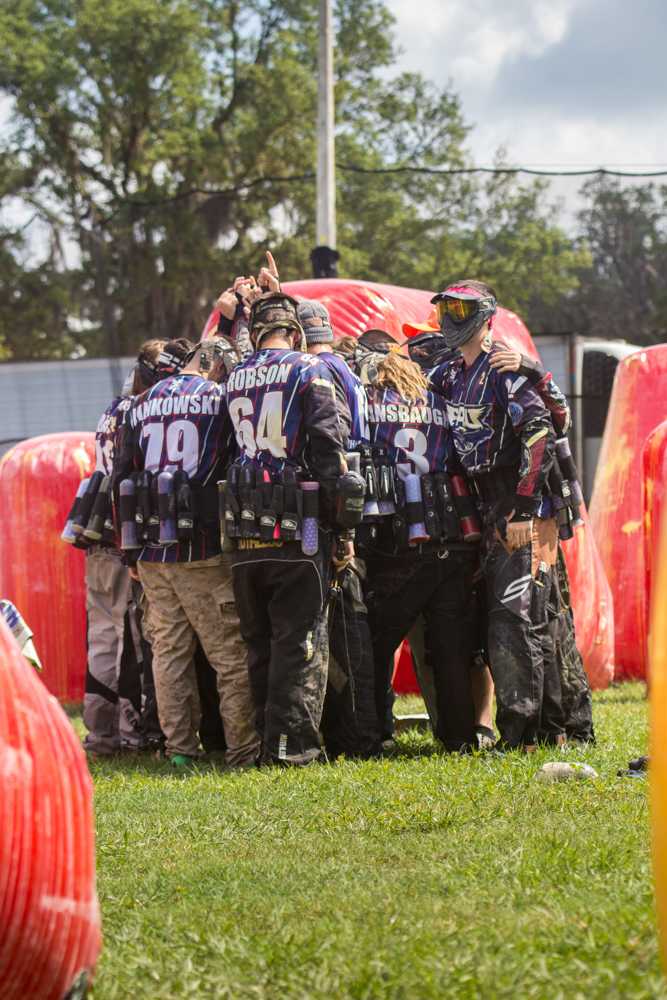 FAU Paintball club members huddle together one last time before the start of a match at the 2015 NCPA National championships in Lakeland, Florida. Photo courtesy of  Rick Applegarth| nVoke Media