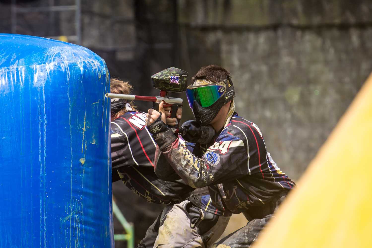 Corbin Robson (no. 64) steps out from behind a bunker while his teammate covers the opposite side.  Photo courtesy ofRick Applegarth|nVoke Media