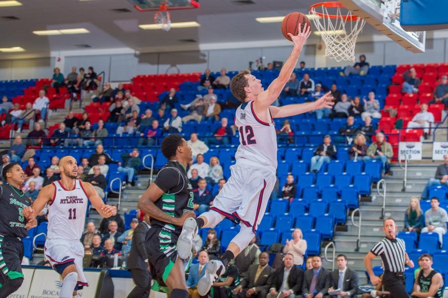 Possessions in mens college basketball will be 30 seconds next season, meaning more chances to score for Jackson Trapp (12) and the FAU basketball program. Photo by Max Jackson 