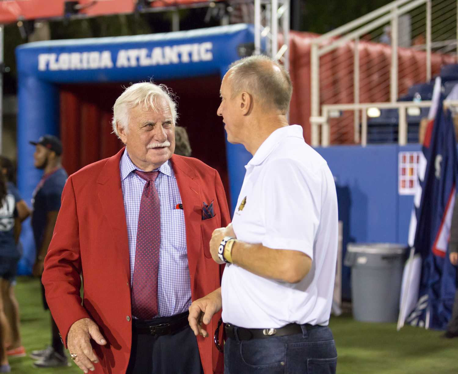  Howard Schnellenberger, former head football coach of both FAU and Miami’s teams, discusses the game with former NFL Buffalo Bills quarterback and University of Miami alumni Jim Kelly. Schnellenberger coached the Owl football program for 11 seasons, retiring after the 2011 season. Brandon Harrington | Contributing Photographer