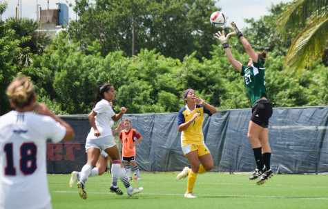 Redshirt junior Sydney Drinkwater jumps to make a save during Sunday's game versus UC Irvine. Drinkwater had three saves during the game. Ryan Lynch| Sports Editor