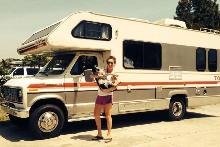 Alexa Caskey and her dog, Beans, standing in front of the RV they travel the country in. Photo courtesy of Alexa Caskey