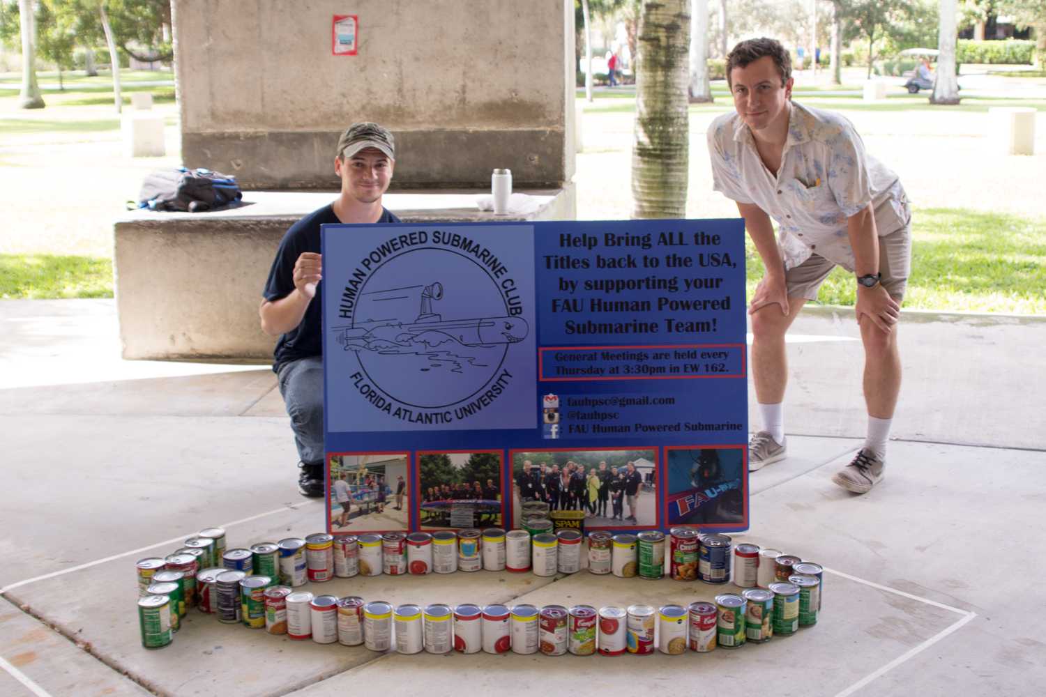 Michael Denny and Josh Jacobs of the human-­powered submarine club promote their club during the ExtravaCANza. Their submarine sculpture took them about 10 minutes to make. Photo by Patrick Martin|News Editor