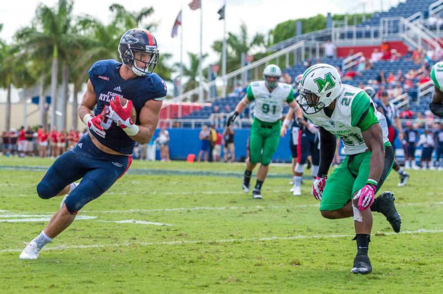 FAU tight end Tyler Cameron (3) eyes up Marshall defender Tiquan Lang (21) as he picks up five yards in the third quarter of last Saturday’s 33-17 loss. Cameron had 111 receiving yards on the day – more than all other Owls receivers combined. Photo by Max Jackson|Staff Photographer