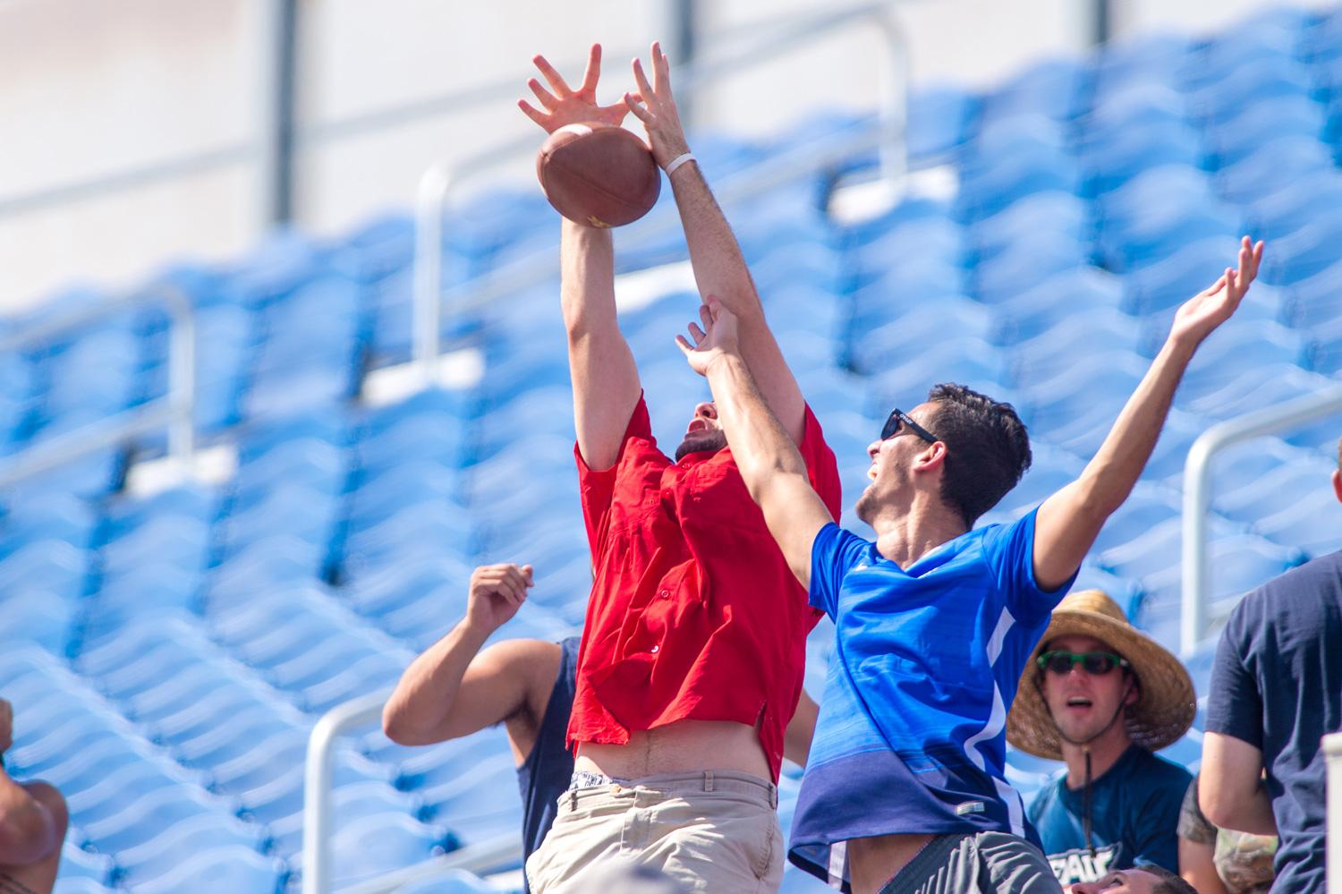 Students attempt to catch a ball that went through the upright earlier this season. Max Jackson | Staff Photographer