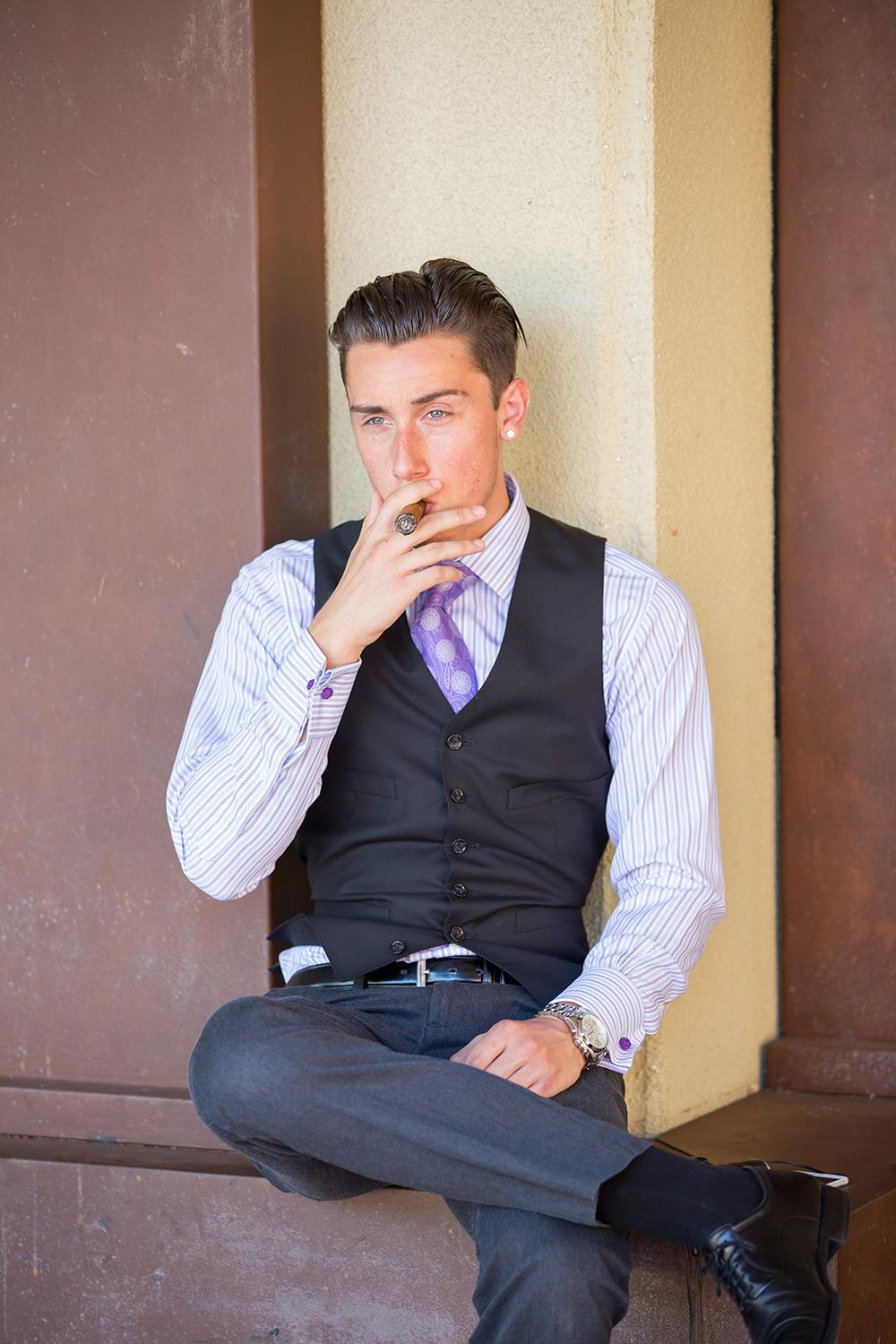 Collon Paul-Hus, freshman, undeclared major, smoking a cigar. Brandon Harrington | Photo ditor