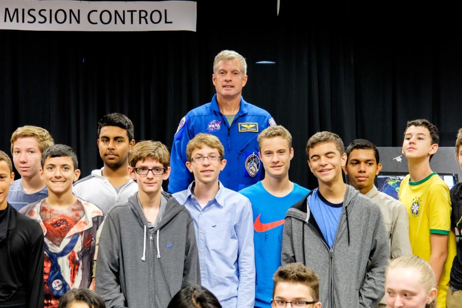 Astronaut Steven R. Swanson pose for a photo with students from different high schools. Mohammed F Emran | Asst. Creative Director
