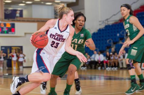 Senior guard Alison Gorrell (23) dribbles past a UAB defender last season. Photo by Max Jackson | Staff Photographer