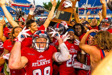 Members of the FAU football team celebrate after their 31-17 win over Florida International on Oct. 31. Photo by Max Jackson | Staff Photographer