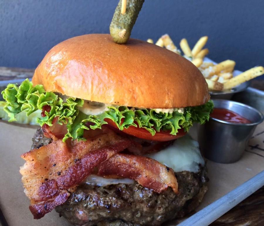 TAP 42’s own “The Prohibition” — a burger blend of applewood bacon, white cheddar, their secret sauce and more. Photo courtesy of TAP 42’s Facebook page.