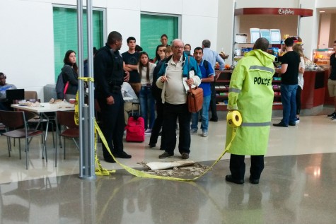 Police section of part of the College of Business lobby where a ceiling tile fell on a students head. Photo by Mohammed F. Emran | Staff Photographer