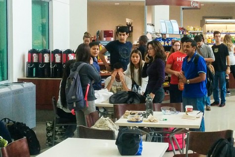 Students sitting just one table over from where the ceiling tile fell. Photo by Mohammed F. Emran | Staff Photographer