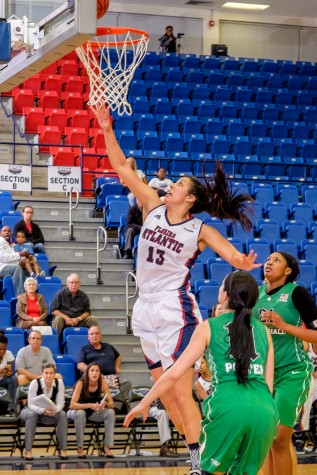 FAU forward Kat Wright (13) goes up for a layup. Wright had a career-high 22 points against Marshall. Mohammed Emran | Staff Photographer