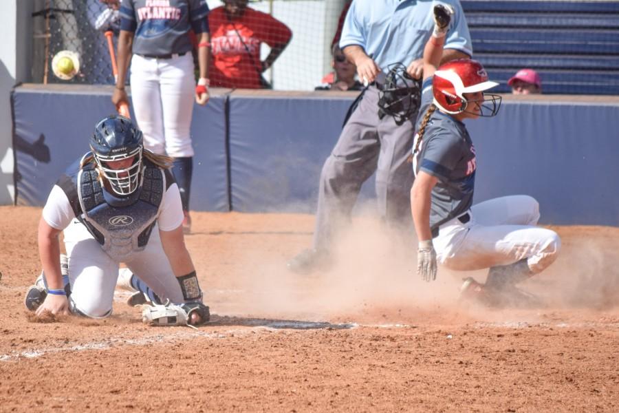 Senior outfielder Christina Martinez comes in to score as the Owls’ second run of the game in the bottom of the third to give them a 2-0 lead. Ryan Lynch | Multimedia Editor