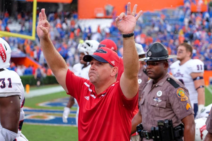 Head coach Charlie Partridge puts up owl fingers to fans after FAUs 20-14 overtime loss
at the University of Florida last season. Mohammed F. Emran | Staff Photographer