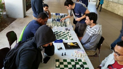 The Chess Club frequently meets on the Breezeway, encouraging passers-by to join them. Photo courtesy of Corey Zapin, club president.