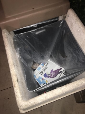 Copies of the UP's latest issue were found in the trash cans beside the bins they were taken from. Photo by Bill Good, Distribution Manager