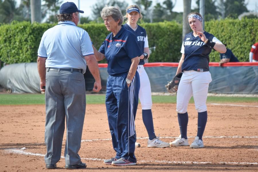 Head softball coach Joan Joyce talks to an umpire about a collision that had happened between second and third base during the Owls game versus Penn State on Feb. 14.  Ryan Lynch | Multimedia Editor