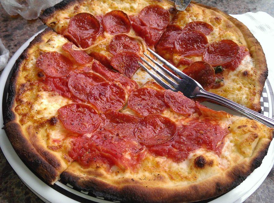 Ordering pizza is pretty pricey, so why not make your own, exactly the way you want it? Homemade pizza is a great starting point for students who want to learn how to cook their favorite foods. Photo courtesy of Wikimedia commons.