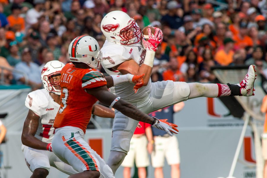 Owls+linebacker+Nate+Ozdemir+%2850%29+intercepts+a+pass+intended+for+Hurricanes+wide+receiver+Stacy+Coley+%283%29+at+Miamis+48-yard+line+in+FAUs+loss+on+Sept.+10.+Max+Jackson+%7C+Staff+Photographer