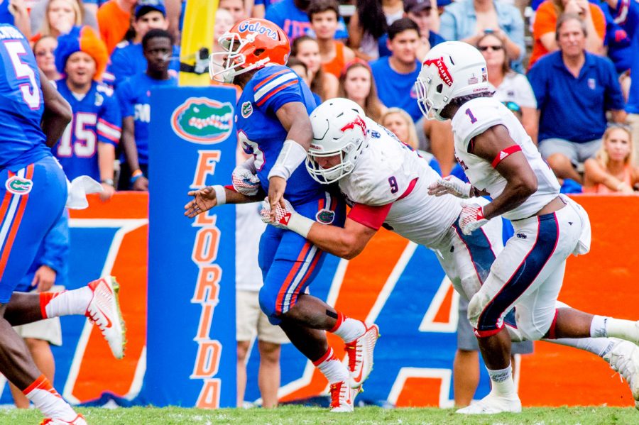 Trey Hendrickson sacks University of Florida quarterback Treon Harris in the fourth quarter of the Owls 2015 game versus the Gators, forcing Harris to fumble the ball. The sack allowed Hendrickson to tie the program record of 16 career sacks. Photo by Max Jackson