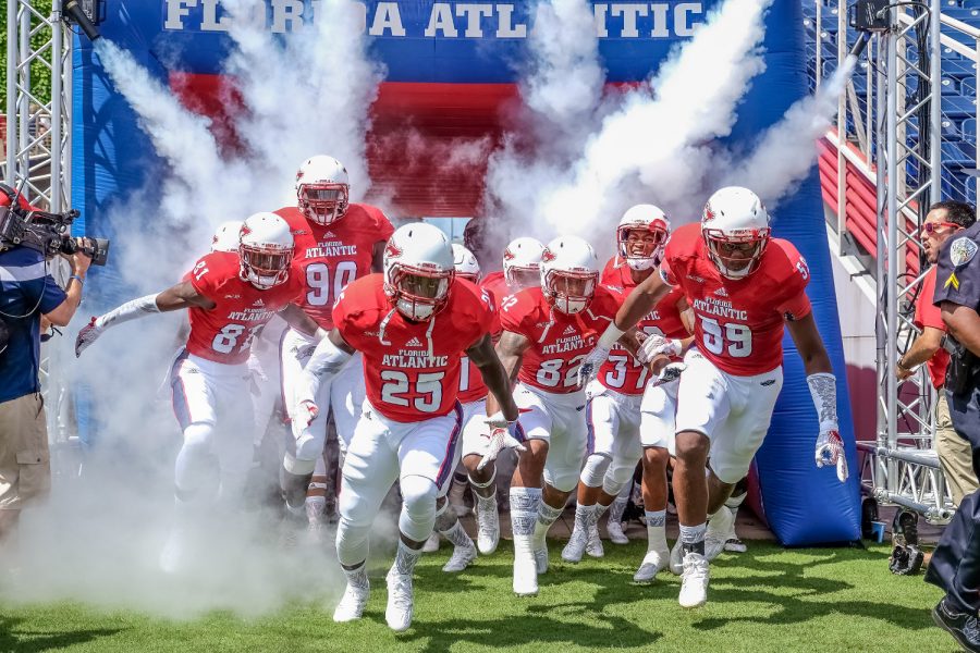 Florida Atlantic Football players enter the field before the start of their game versus Buffalo. Mohammed F. Emran | Staff Photographer