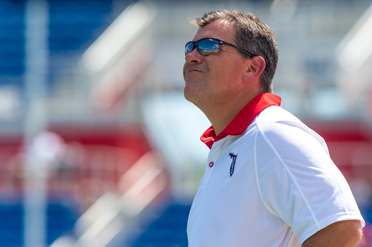 FAU head coach Charlie Partridge grimaces while looking at the scoreboard after Charlotte's third touchdown of the game. 