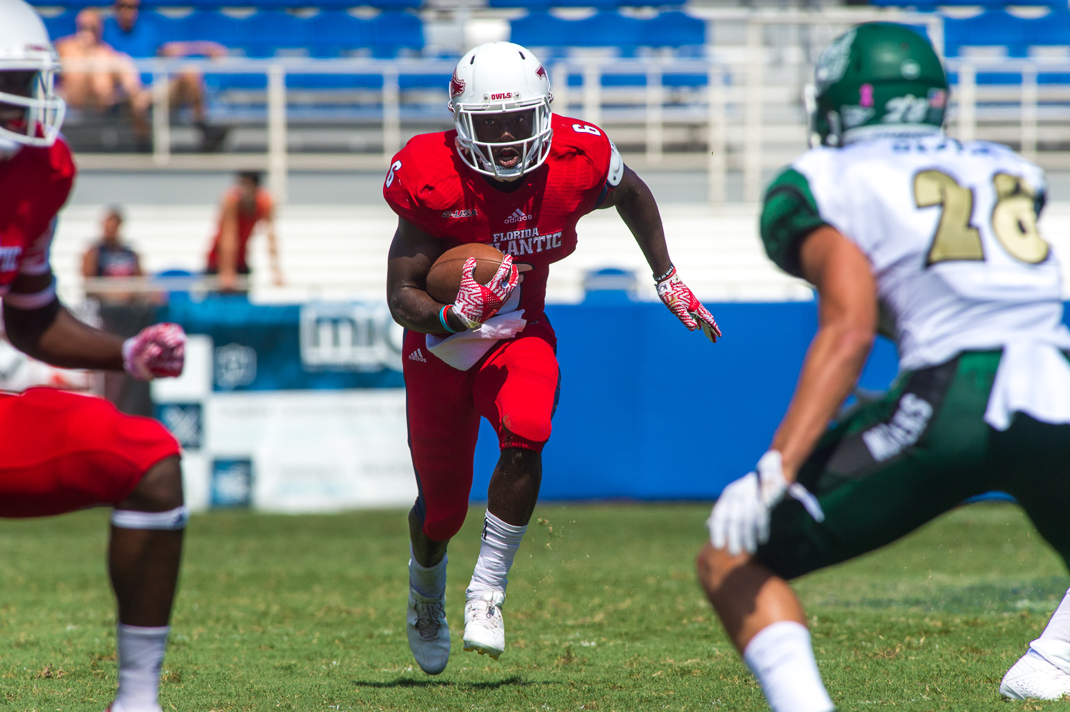 Owls running back Devin Singletary (6) looks for an opening in the Charlotte defense. Singletary had seven carries for 25 yards on the day. 