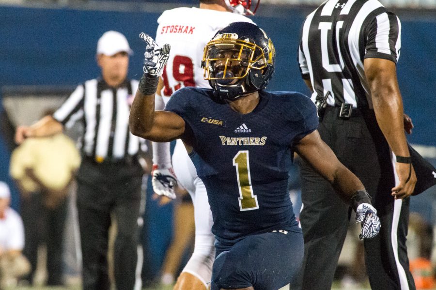 FIU junior running back Alex Gardner (1) points forward in celebration after picking up a first down late in the fourth quarter. Max Jackson | Staff Photographer