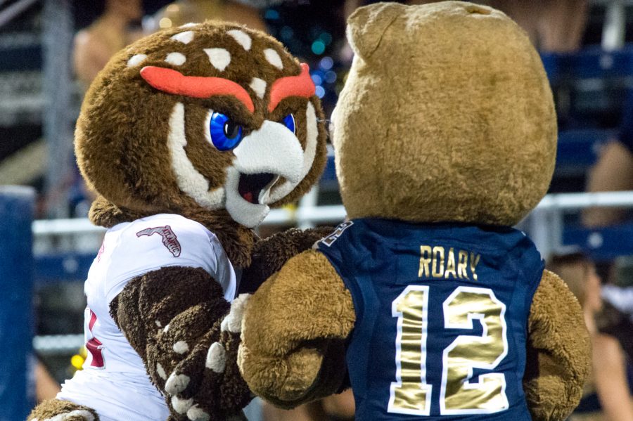 FAU’s mascot Owsley and FIU’s mascot Roary pretend to fight in the endzone during a break in the game. Max Jackson | Staff Photographer