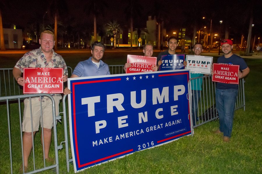 The FAU College Republicans display signs supporting Donald Trump before the start of the third presidential debate. Craig Ries | Contributing Photographer