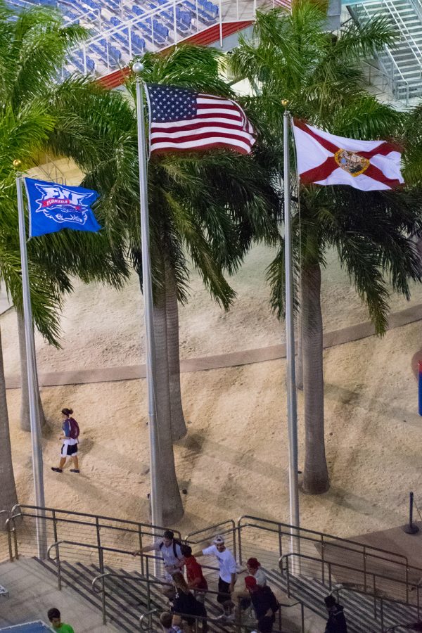 The U.S, Florida state and FAU flags fly together near the entrance to FAU Stadium during the third presidential debate. Craig Ries | Contributing Photographer