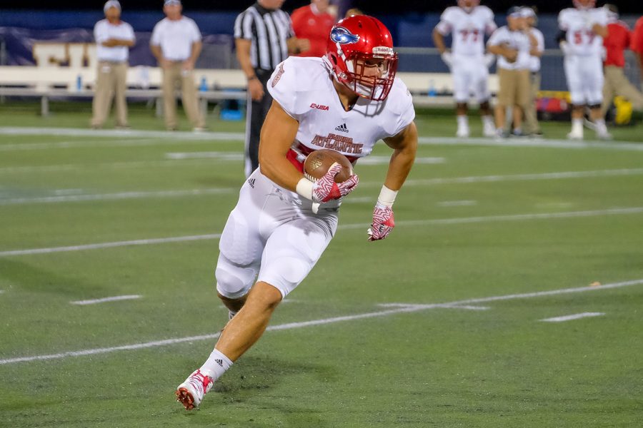 FAU tight end John Raine (30) runs the ball after receiving a pass from quarterback Jason Driskel (16). Mohammed F Emran | Staff Photographer