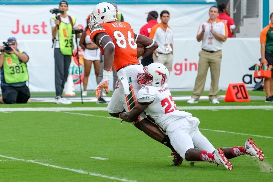 Junior defensive back Raekwon Williams takes down Miami tight end David Njoku in the Owls loss on Sept. 10. Mohammed F. Emran | Staff Photographer