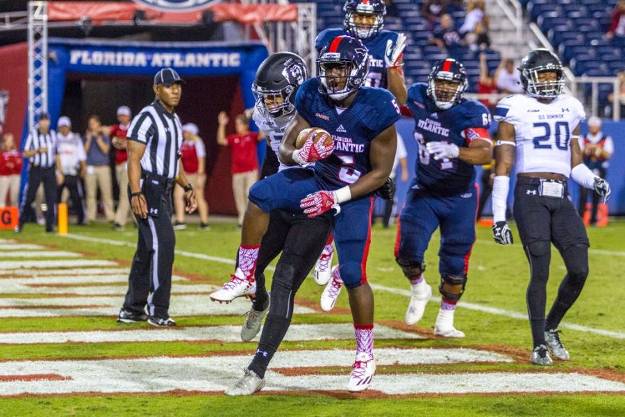Freshman+running+back+Devin+Singletary+scored+two+touchdowns+in+the+Owls+42-24+loss+to+Old+Dominion+on+Saturday+night.+Alexis+Hayward+%7C+Staff+Photographer