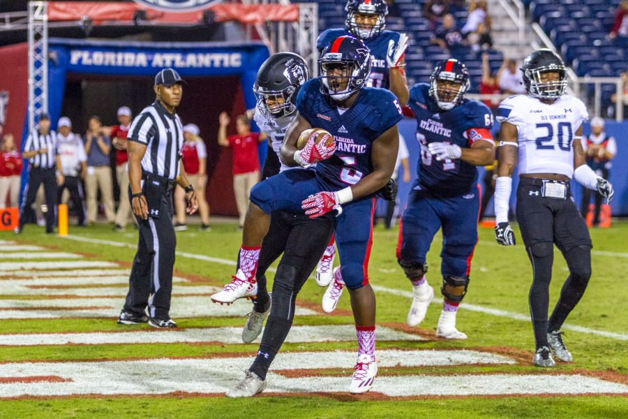 Alexis Hayward | Contributing Photographer Freshman running back Devin Singletary scores his second touchdown of the game to extend the Owls lead to 21-10.