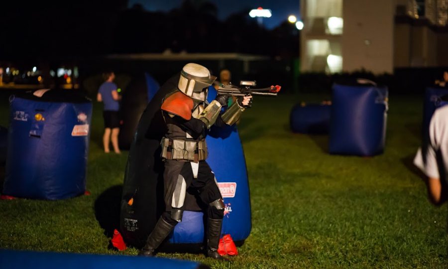 Nicholas George, member of the Mandalorian Mercs Costume Club rushes the opposing team in laser tag. Alexander Rodriguez | Contributing Photographer 