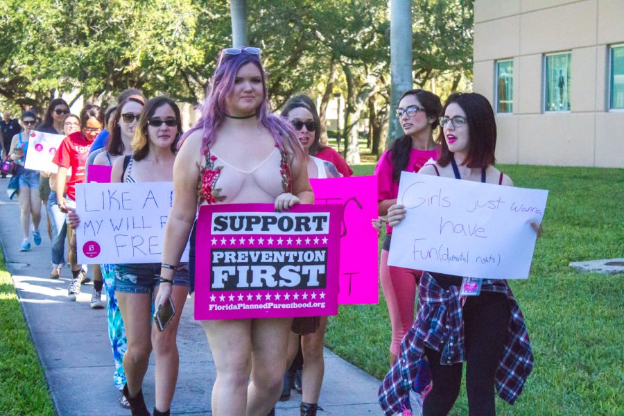 College Democrats Women’s Caucus Chair  Sophie Siegel (right) marches with other protestors against rape culture. Joe Pye | News Editor