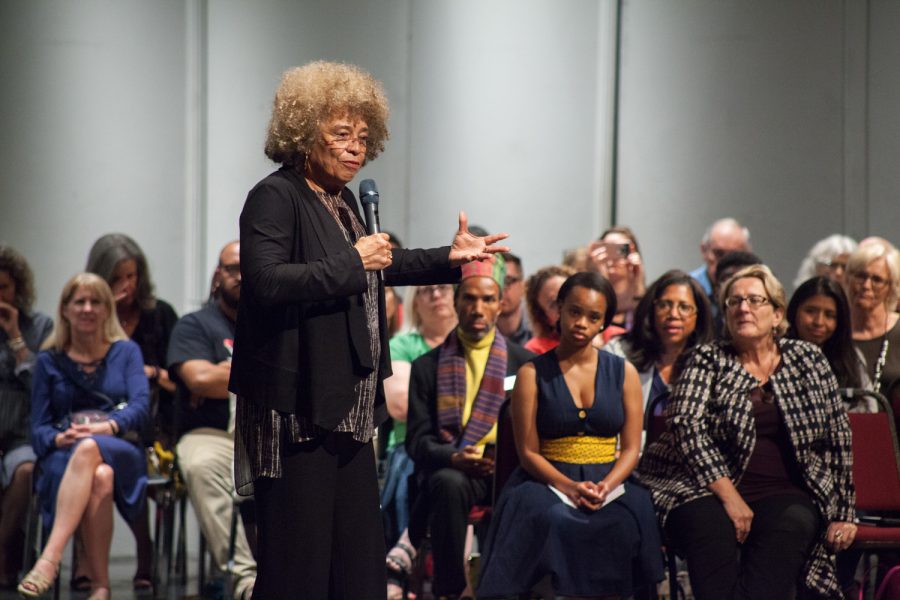 Angela Davis adresses the crowd at the University Theatre during her sppech Thursday. Photo courtesy of Charles Pratt