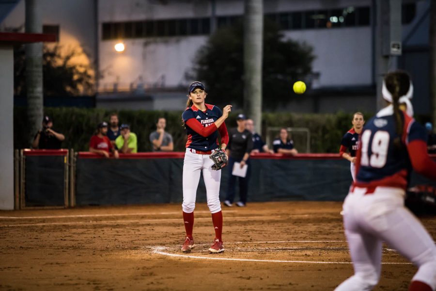 Senior Kylee Hanson tosses the ball over to sophomore first baseman Lauren Whitt in the Owls 1-0 victory over North Florida. Hanson stuck out 10 batters in her fist win of the season. Alexander Rodriguez | Contributing Photographer