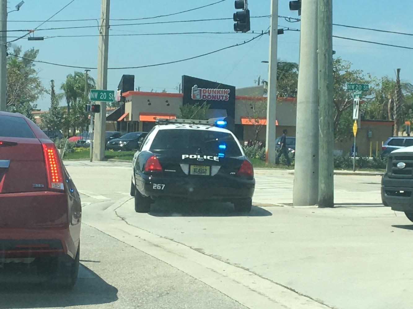 A Boca Raton police cruiser sits at the intersection of 20th and 2nd Street Friday while the department looks for a suspect in the area. Joe Pye | News Editor