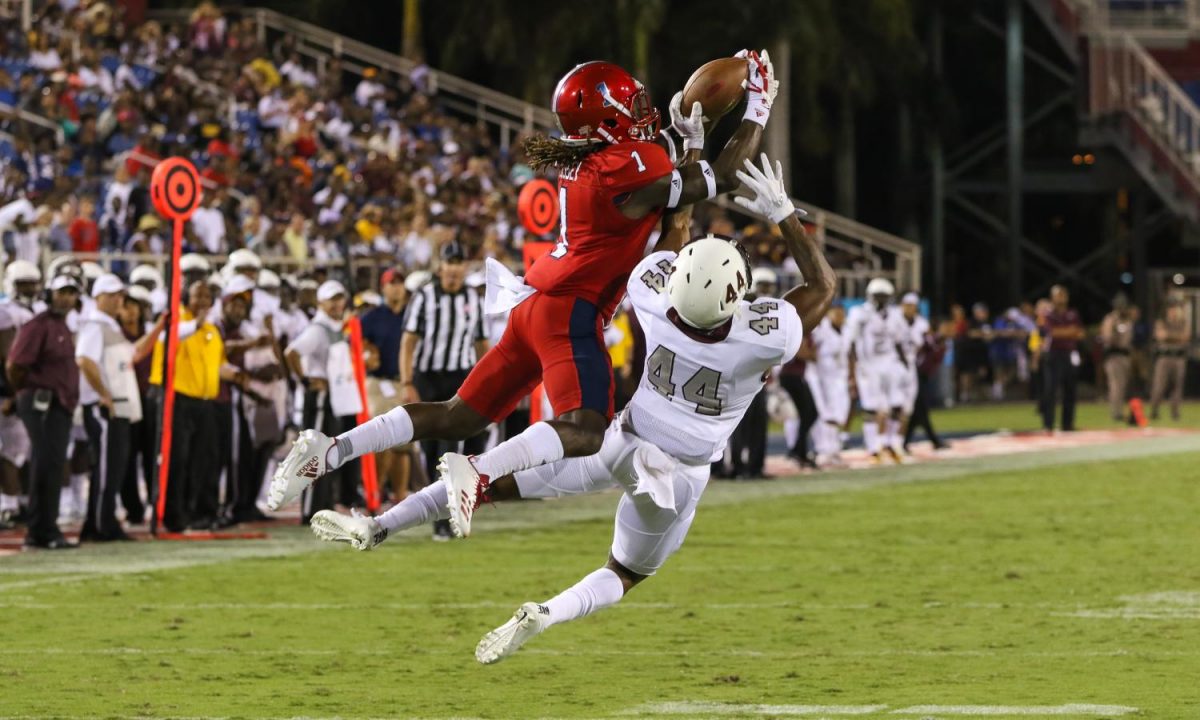FAU senior wide receiver Henry Bussey catches the ball 10 yards from the FAU end zone during the Owls win over the Bethune-Cookman Wildcats. Joshua Giron | Contributing Photographer