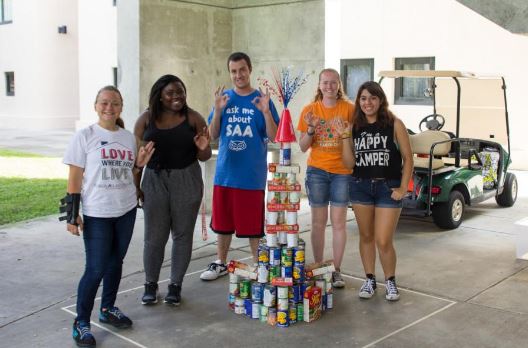 Members of the Student Alumni Association pose with their finished sculpture at the 2015 ExtravaCANza competition. Photo courtesy of Patrick Martin