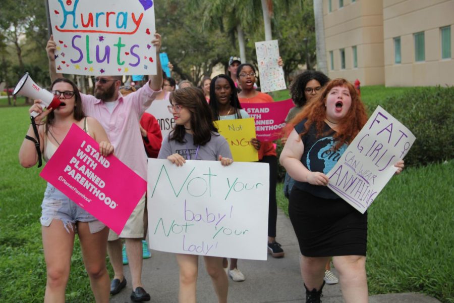 Students marching down Diversity Way, led by College Democrats Vice President Sophie Siegel. | Ofelia Pinnock