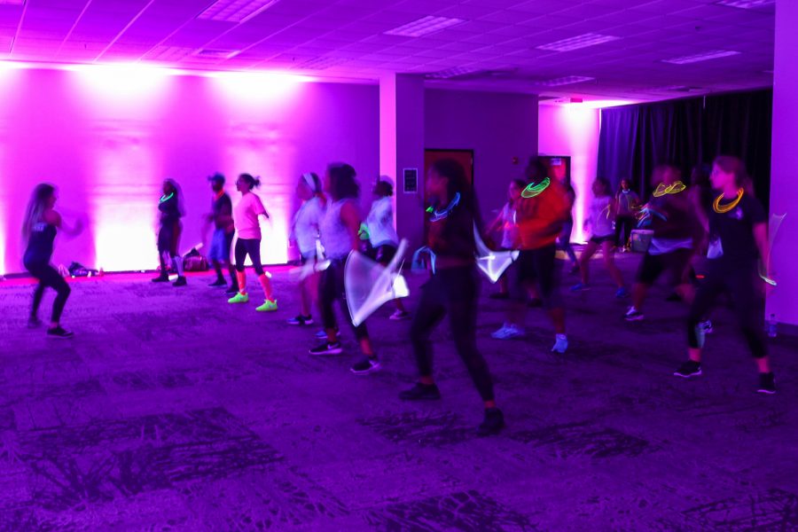 Students with glow-in-the-dark accessories danced during the zumba class on Monday night. Photo Editor | Joshua Giron 