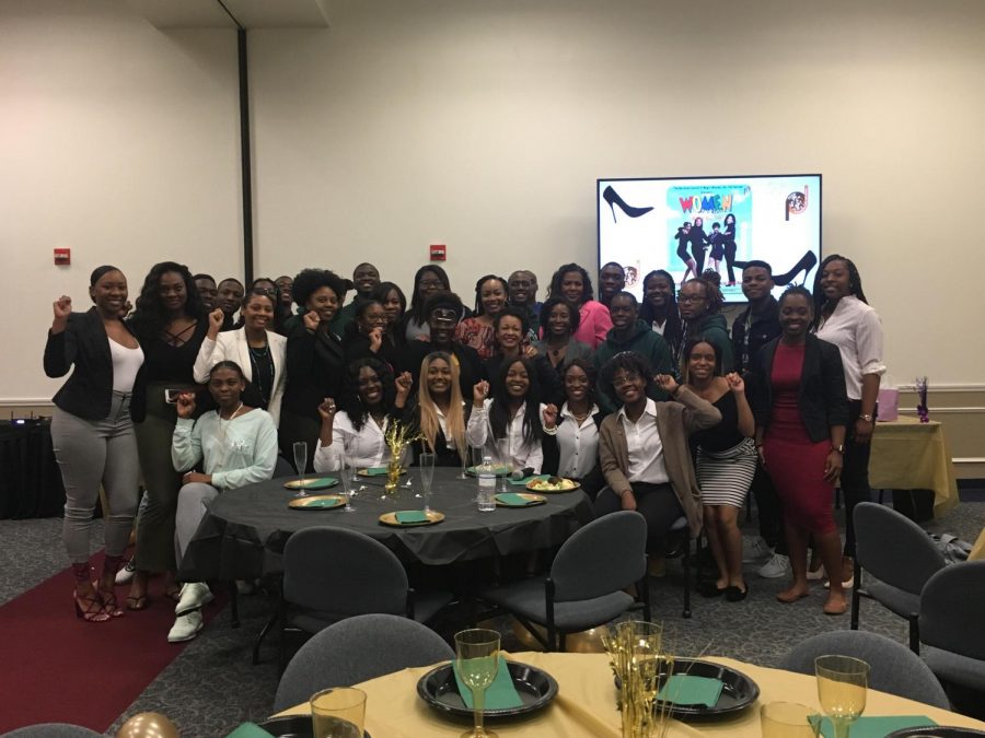 The FAU chapter of the National Council of Negro Women pose with panel members. Destiny Harris | Contributing Writer