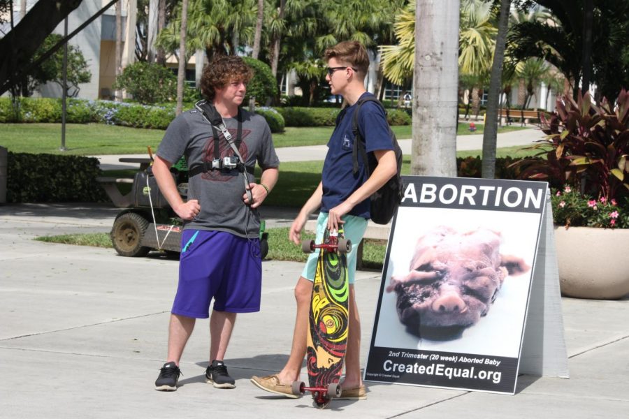 Created+Equal+representatives+wore+body+cameras+this+year+as+they+spoke+to+bypassers+about+the+morals+of+abortion.+Photo+by+Chris+Blackshear+