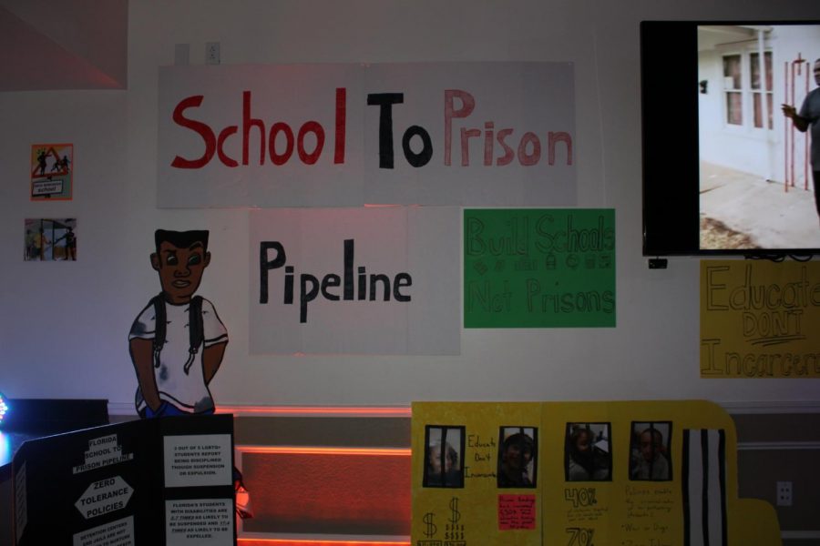 The exhibits were held in a dark room, and one was on the school-to-prison pipeline, or the tendency for minorities to be incarcerated because of harsh school policies. Photo by Makayla Purvis