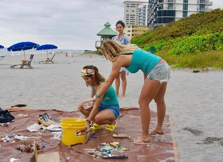Members of FAUs Tritons of the Sea, a new environmental club, clean up the beach. Photo courtesy of Instagram